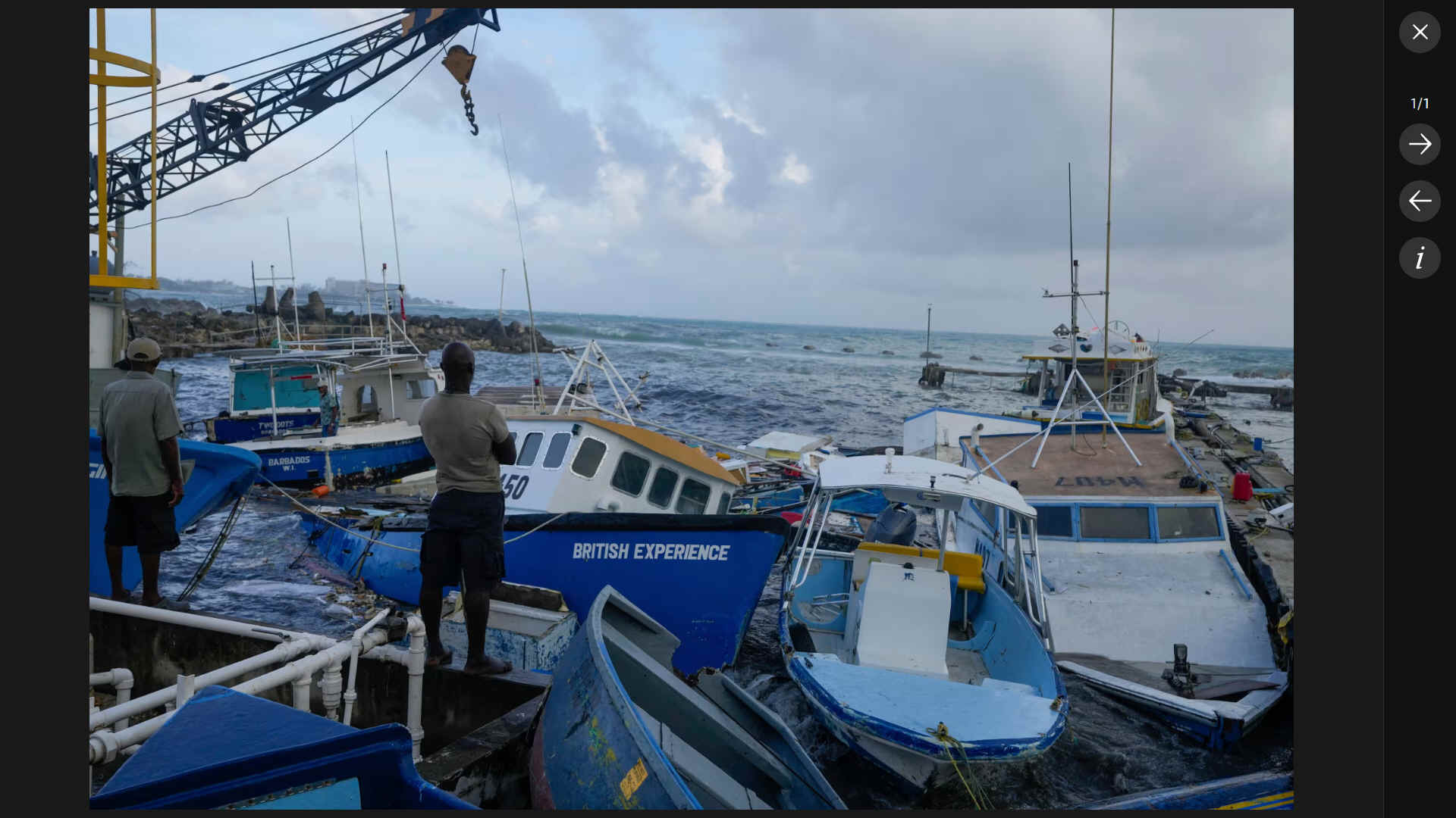 Fisherrmen in Barbados watch their boats being hit by Hurricane Berly, July 2024